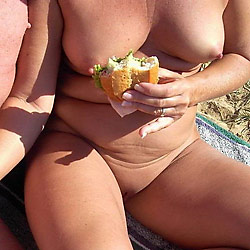 MILF slut flashes strangers in public
