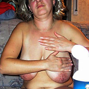MILF slut gets naked in public